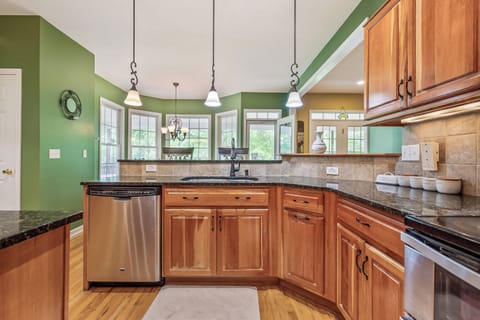 Bright and functional kitchen with stainless steel appliances and a seamless flow into the dining area
