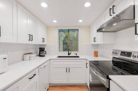 Within this culinary haven, modern appliances stand ready to assist in culinary endeavors, while generous counter space beckons creativity and convenience alike.