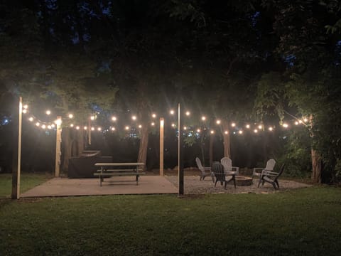 Cabin in Downtown Pigeon Forge "River Cottage" - Outdoor patio area at night