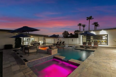 Evening bliss! Private pool, hot tub, and fire pit under a painted sky.