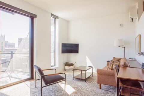 Unwind in a spacious living area that seamlessly blends comfort with modern design