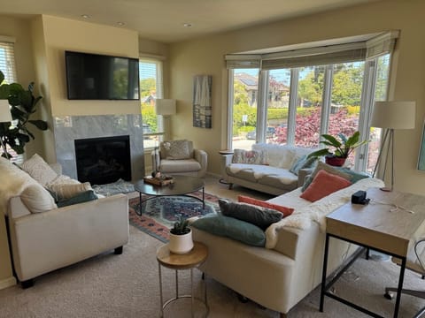 Living room on the main floor. Lots of windows and an open floorplan.