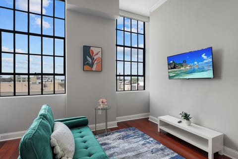 Bright, open-concept studio with smart motorized shades, comfortable seating, and 40" smart TV—your perfect Philadelphia home base.