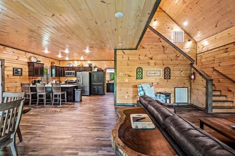 The living room includes a large Smart TV, electric fireplace, ceiling fan, and high ceilings.