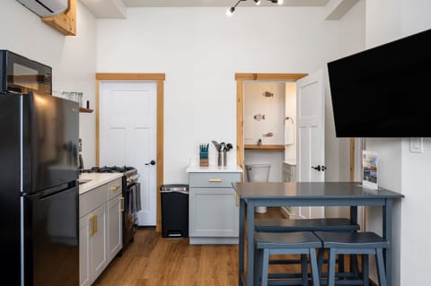 Stylish space with modern appliances and a breakfast bar for delightful meals!