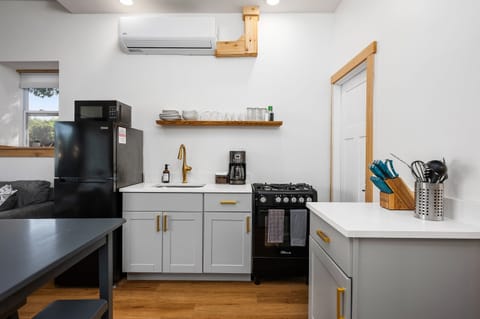 This modern kitchen features sleek appliances and inviting dining space!
