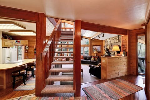 Stairs to loft with queen bed and half bath