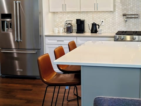 Island seating in chef's kitchen.
