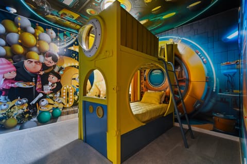Minion-themed bunk room for kids with vibrant walls and playful decor
