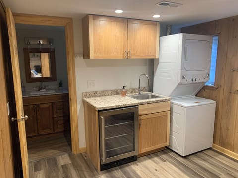 Washer, dryer and attritional mini fridge on lower level