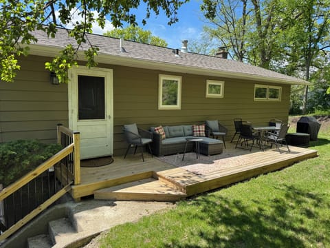 Private furnished outdoor deck facing wooded area