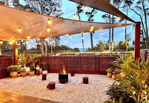 Front garden, ocean views. Enjoy the fire pit on cooler nights.