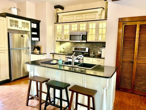 Chefs kitchen w/ SS appliances & granite counters. All new dinnerware.