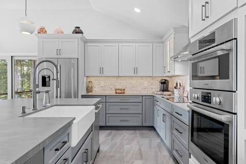 Chef's Kitchen with every amenity, including wine fridge and induction stove