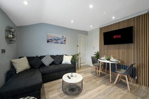 The stylish living area benefitting from a Smart TV with Netflix and a double sofa bed.