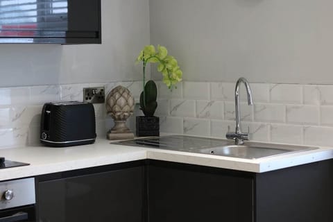 The apartment includes a modern kitchen/dining area, which is open plan and fully equipped with all of the utensils & crockery you need to cook during your stay.