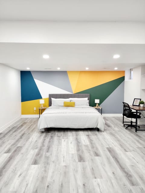Downstairs 4th bedroom: spacious with king-size bed and workstation.