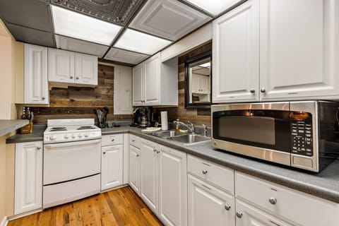 This second fully equipped kitchen is great for early mornings, late night snacks, and hanging out in the game room.