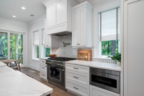 Gas range with pot filler faucet