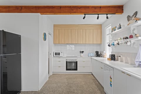 Prepare home-cooked meals in the fully-equipped, modern kitchen