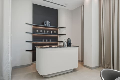 "Indoor-outdoor elegance. Our bespoke lounge and bar area open directly onto the vast terrace, offering seamless flow for entertaining