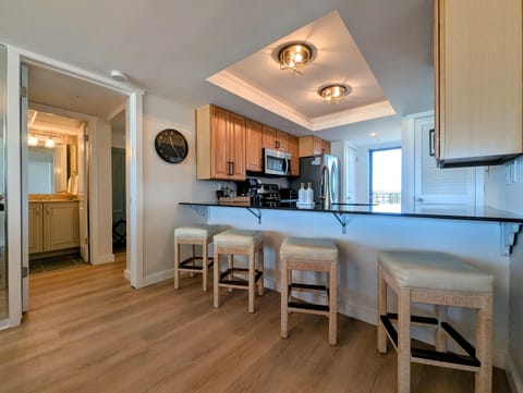 Bright kitchen with breakfast bar and modern appliances