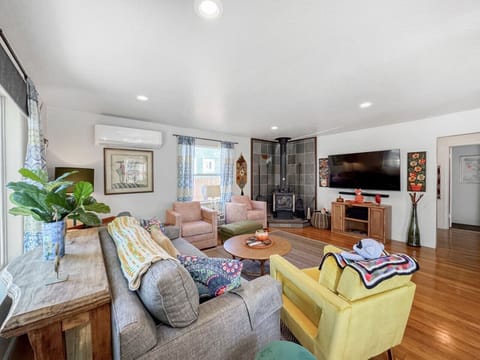Large living room with plenty of space to kick back and stream your favorite shows or movies on the large smart TV
