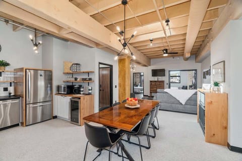 Step into your bright, airy living area, illuminated by a skylight. A spacious table for eight stands ready for delightful dinners and cheerful gatherings. It’s a perfect blend of light and warmth!  A skylight lets in natural light during the day.