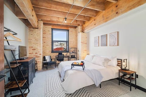 Imagine a cozy master bedroom bathed in sunlight, offering a warm and inviting atmosphere. This space features a private bathroom for your comfort, as well as an excellent workspace with views of the city of Duluth and the William A Irvin.