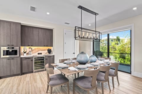 Experience the joy of cooking and entertaining with a sleek wine fridge keeping your favorite vintages perfectly chilled, just steps from the elegant dining space.