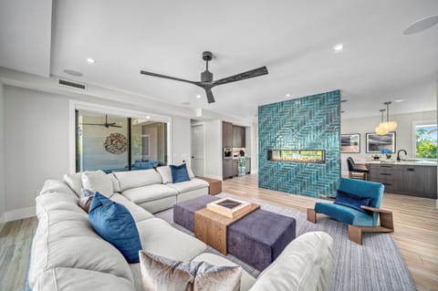 Sink into cozy comfort as the fireplace flickers, setting a warm and inviting mood for relaxing evenings with loved ones.