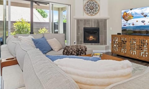 "Unwind in Style: Plush Comfort Meets Modern Elegance at Irvie Homes 🏡 - Cozy Fireplace, Chic Decor, Sun-Soaked Spaces, & Giant Screen for Ultimate Relaxation. Book Your Luxurious Getaway Today! #VacationRental #HomeAwayFromHome #LuxuryLiving"
