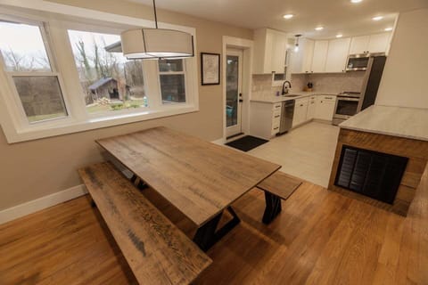 Dining table and kitchen.