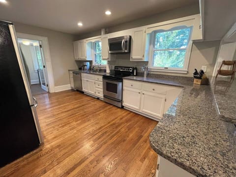 The kitchen is fully stocked! Pots, pans, dishes, coffee maker, kettle, blender, toaster, wine glasses, and more. Make sure you check the pantry for outside plates, cups, and wine glasses.