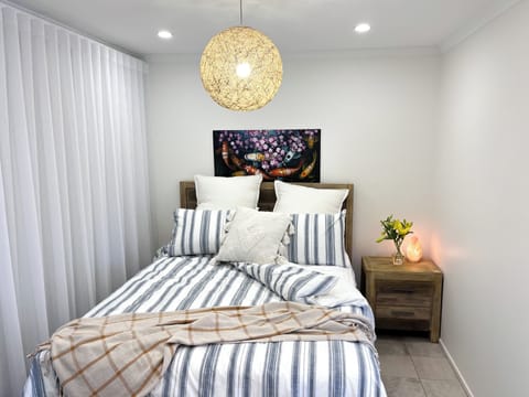Luxurious sheets, spare blanket, blackout curtains for a serene, restful night.