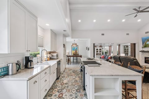 Cook memorable meals in your gourmet kitchen with marble countertops, modern appliances, and a spacious island perfect for gathering.