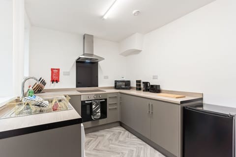 A fully equipped kitchen with everything you need to prepare a home cooked meal.