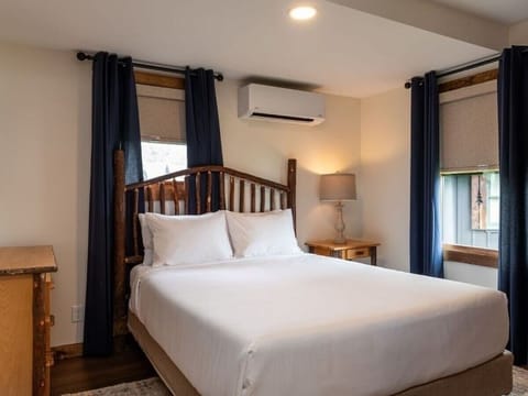 Drift off beneath blackout curtains in a serene bedroom.