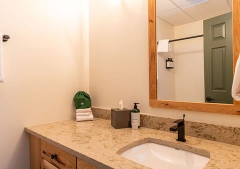 Refresh easily at the spacious vanity with bright mirror light.