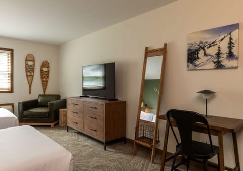 Catch up on emails at the simple desk and comfy chair.