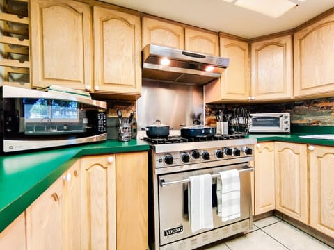 Gourmet Kitchen with 6 burner Viking Gas stove. Plenty of Utensils and cookware for your meal preparations. Microwave, toaster, crock pot etc