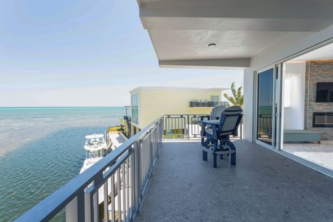 Bedroom with stylish decor and access to a private balcony