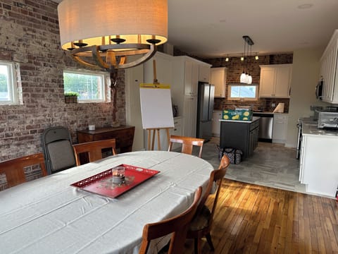 Dining room table seats 6 and is connected to a full kitchen. 