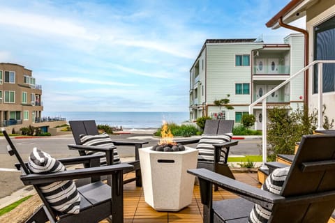 Beautiful ocean view with the warm embrace of the warm fire pit