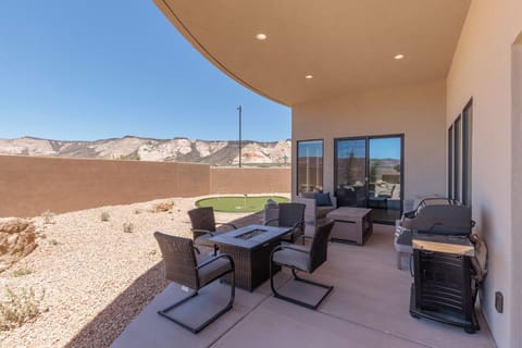 Back Patio Fire Pit - Stay warm next to the fire-pit and relax while watching the sunset over the red mountains.