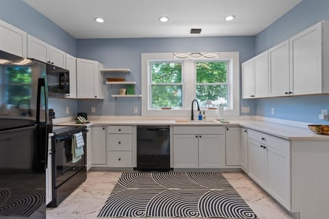 Spacious and fully equipped kitchen with ample cupboards