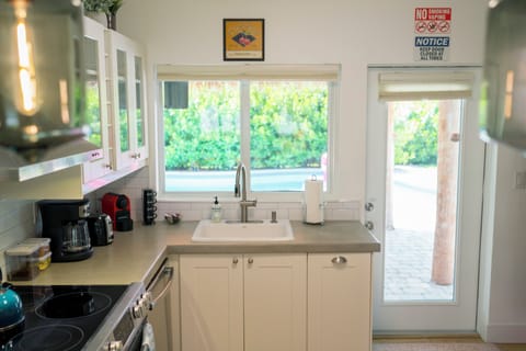 Kitchen with pool area view.