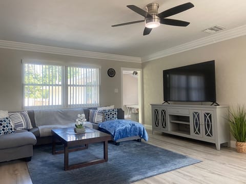 Unwind in the Cozy living room with air conditioning, and large TV.