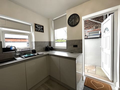 Kitchen leads out to private back yard / patio