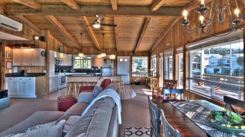 Sand Pads Living and Dining Area - Living and dining area showing kitchen counter and second floor entry.